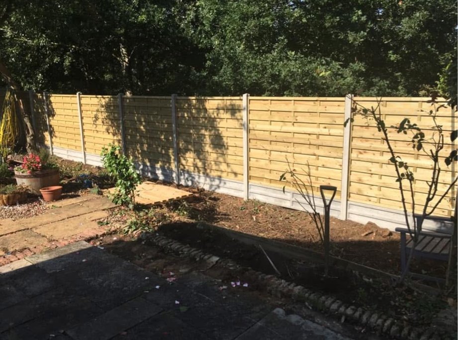 Lap panel fence with concrete posts